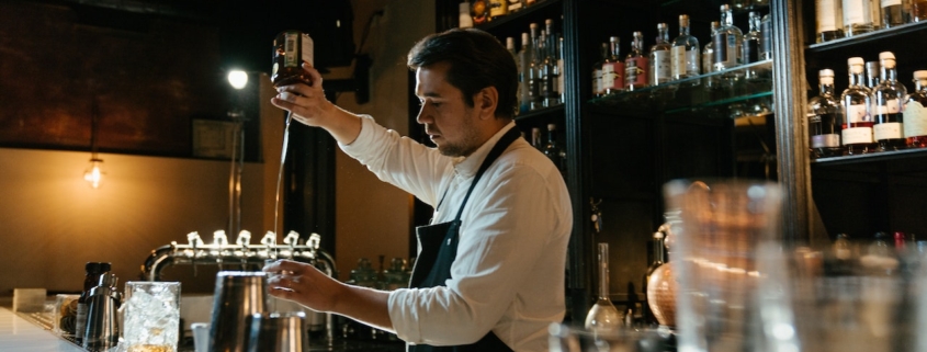 man pouring liquor - Anytime Bar Supplies Pour Spouts