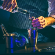 person using a pour spout to pour a liquid - Anytime Bar Supplies Pour Spouts