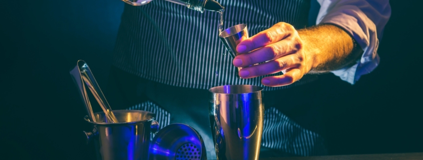person using a pour spout to pour a liquid - Anytime Bar Supplies Pour Spouts