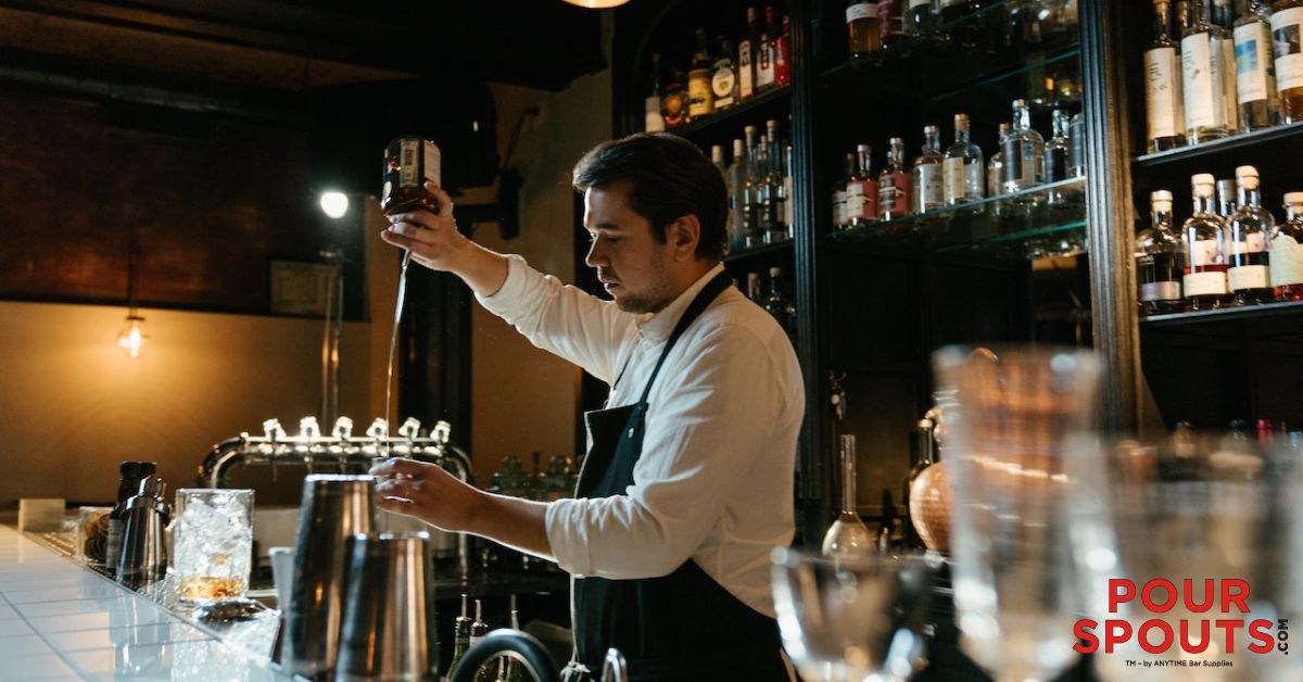 man pouring liquor - Anytime Bar Supplies Pour Spouts