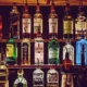 shelves of alcohol bottles - Pour Spouts by Anytime Bar Supplies Measure Accurate Liquor Pours