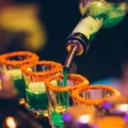 AnytimeBarSuppliesPourSpouts-stainless-steel-pour-spouts-041820251 person pouring liquor into shot glasses - Anytime Bar Supplies Pour Spouts wholesale pour spouts