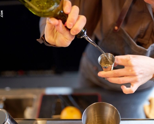 person pouring alcohol into a glass - Pour Spouts by Anytime Bar Supplies Measure Accurate Liquor Pours