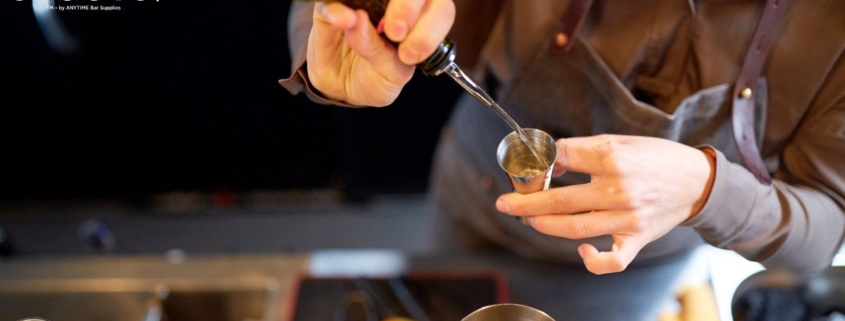 person pouring alcohol into a glass - Pour Spouts by Anytime Bar Supplies Measure Accurate Liquor Pours