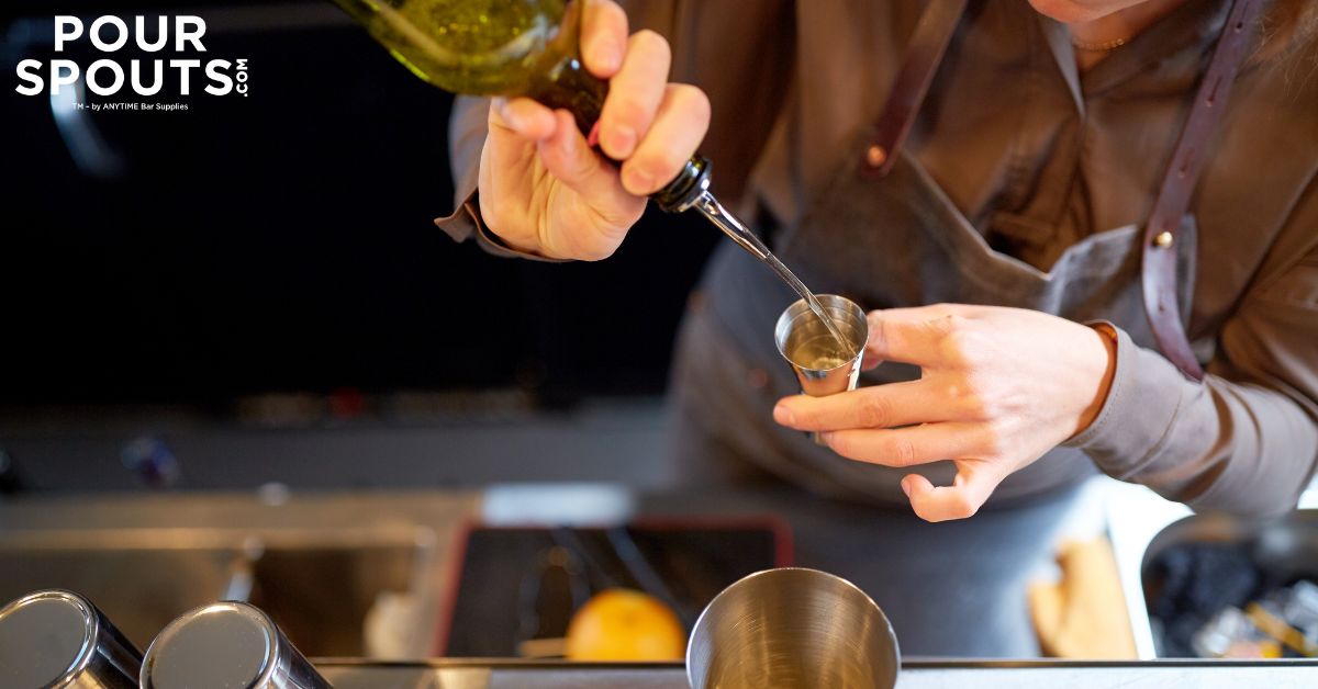 person pouring alcohol into a glass - Pour Spouts by Anytime Bar Supplies pour spout