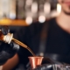 person pouring alcohol into a glass - Pour Spouts by Anytime Bar Supplies pour spout