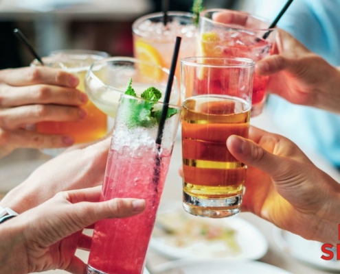 group of people cheering their drinks - Anytime Bar Supplies wholesale Pour Spouts