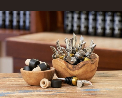 bowl of self closing pour spouts at a bar - Pour Spouts by Anytime Bar Supplies self closing pour spouts