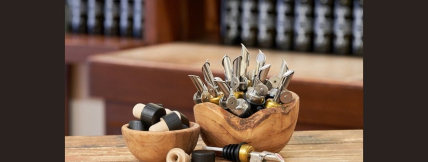 bowl of self closing pour spouts at a bar - Pour Spouts by Anytime Bar Supplies self closing pour spouts