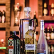 bottles of alcohol on a bar top - Pour Spouts