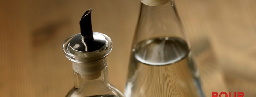 two clear bottles of vinegar - Pour Spouts by Anytime Bar Supplies stainless-steel pour spout for vinegar