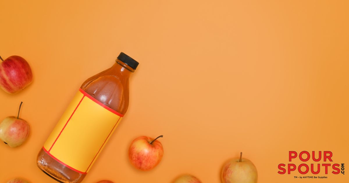 bottle of apple cider vinegar on an orange background - Pour Spouts by Anytime Bar Supplies stainless-steel pour spout for vinegar