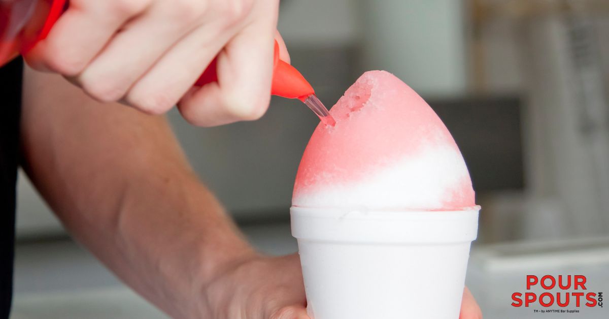 person pouring syrup over a snow cone - Pour Spouts