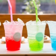 line up of four flavored sodas in fun colors - Pour Spouts