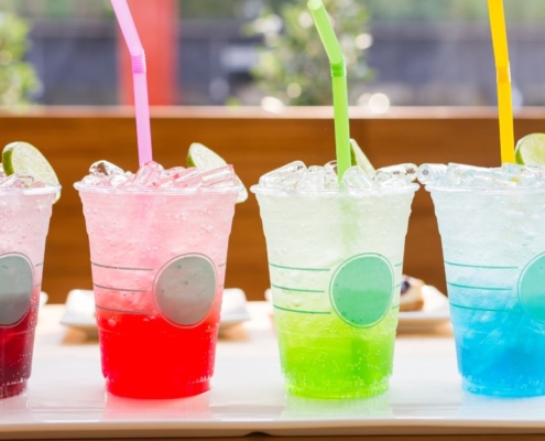 line up of four flavored sodas in fun colors - Pour Spouts