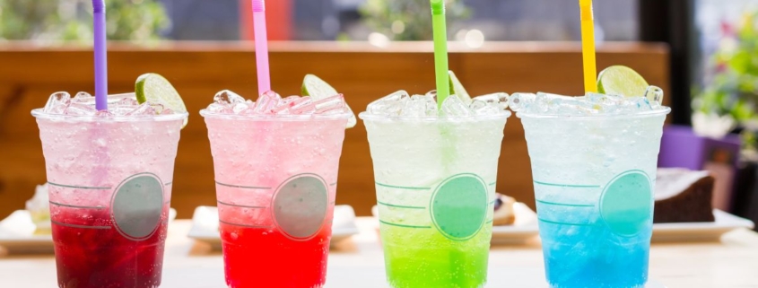 line up of four flavored sodas in fun colors - Pour Spouts
