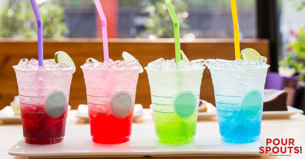 line up of four flavored sodas in fun colors - Pour Spouts