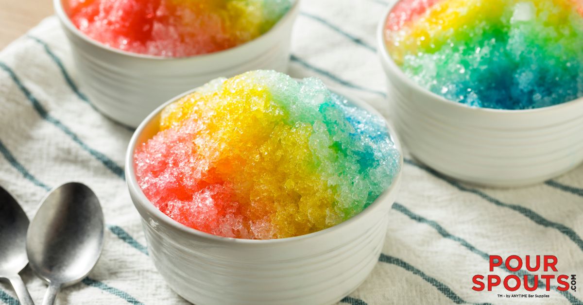 cup of shaved ice with red, yellow and blue syrup - Pour Spouts