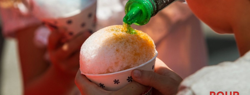 green syrup being poured over a snow cone - Pour Spouts