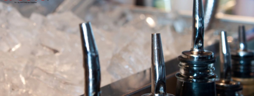 silver pour spouts next to bucket of ice - Pour Spouts professional grade pourers