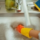 human hand with a glove in soapy sink water - Pour Spouts