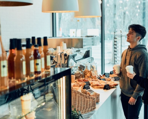 man and woman placing order at a coffee shop - Pour Spouts
