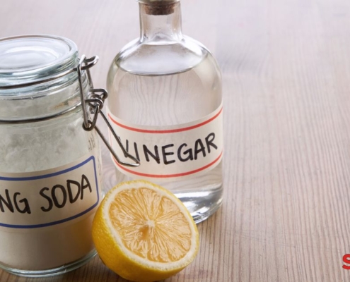 clear container of vinegar and baking soda - Pour Spout